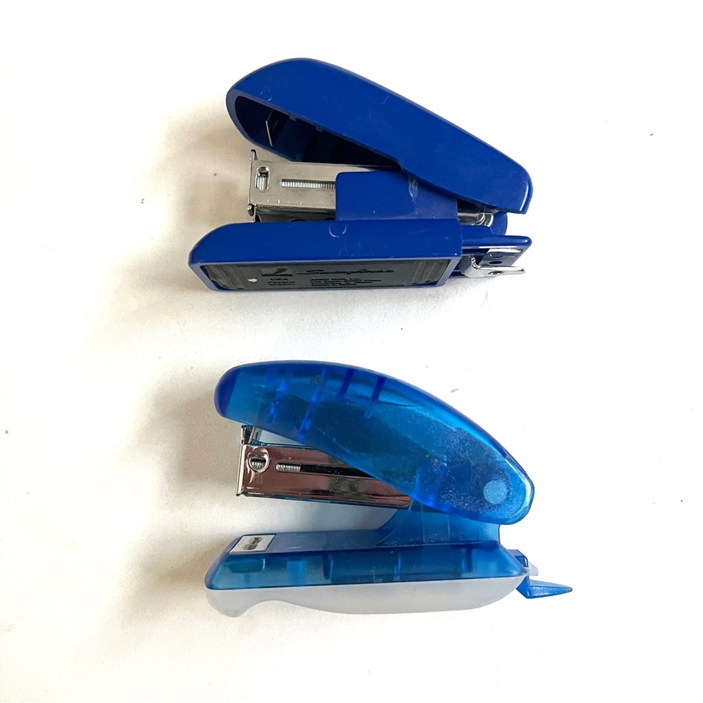 Set of 2 Blue Mini Staplers.lightweight & sturdy. Handy! Fits in pockets :)